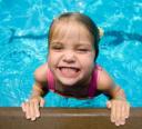 Grinning girl in swimming pool